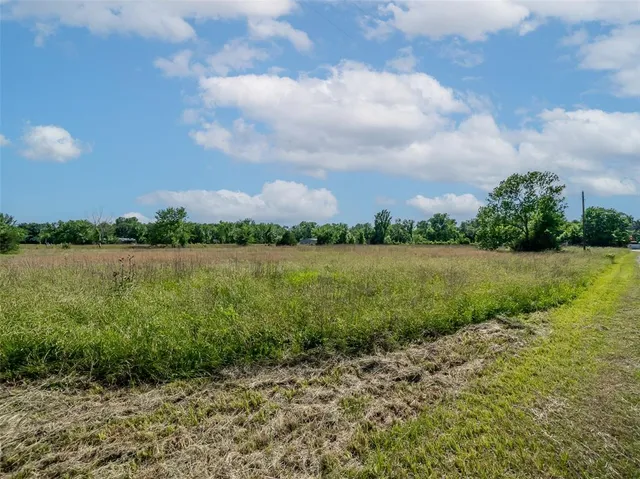 a view of a lake with a big yard
