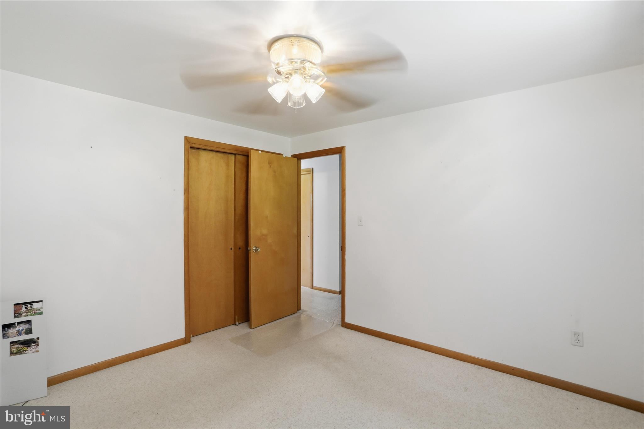 199 Buser Street Ridgeley, WV 26753 - Photo 18 of 49 an empty room with a chandelier fan and a chandelier fan