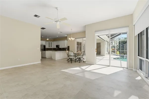 a view of a dining room with furniture wooden floor and chandelier