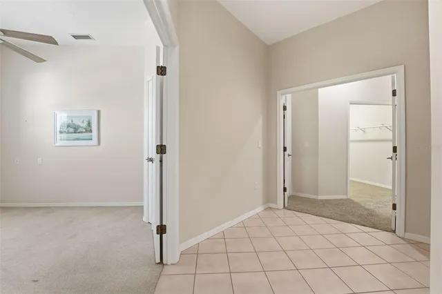 a spacious bathroom with a granite countertop sink mirror and a bathtub