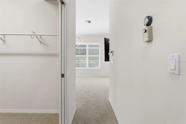 a spacious bathroom with a granite countertop bathtub sink and mirror