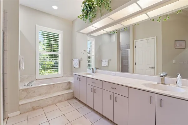 a bathroom with a sink toilet and mirror