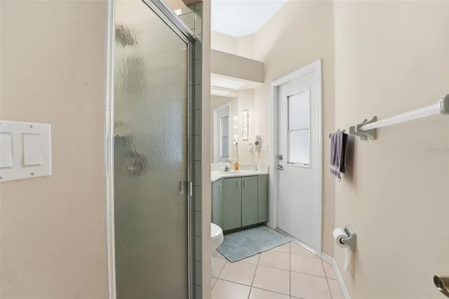 a utility room with cabinets washer and dryer