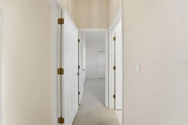 a view of a room with wooden floor and a chair