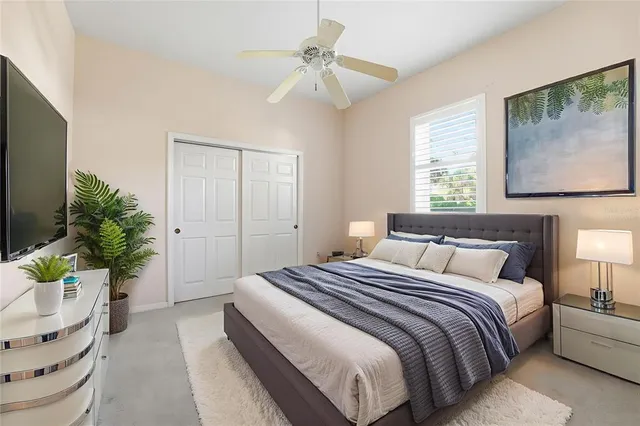 an aerial view of residential houses with outdoor space and trees