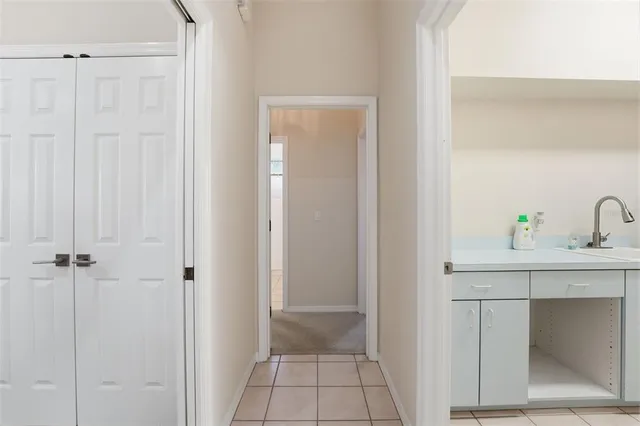 an aerial view of a houses with a yard