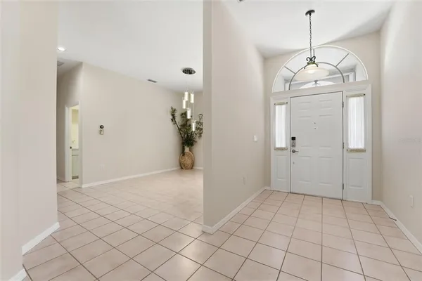a view of a dining room with furniture and window