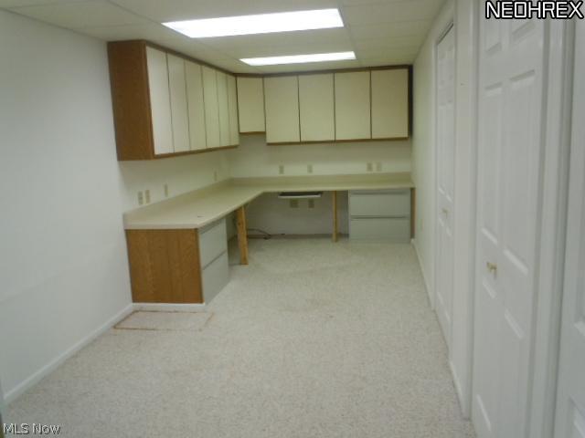 4629 West Bath Road Akron, OH 44333 - Photo 15 of 23 Basement office is already for you to organize your paper work, books, computer and what ever else you need to have out of the main living areas of the home. More storage closets to the right.