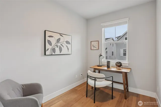 a workspace with furniture and wooden floor