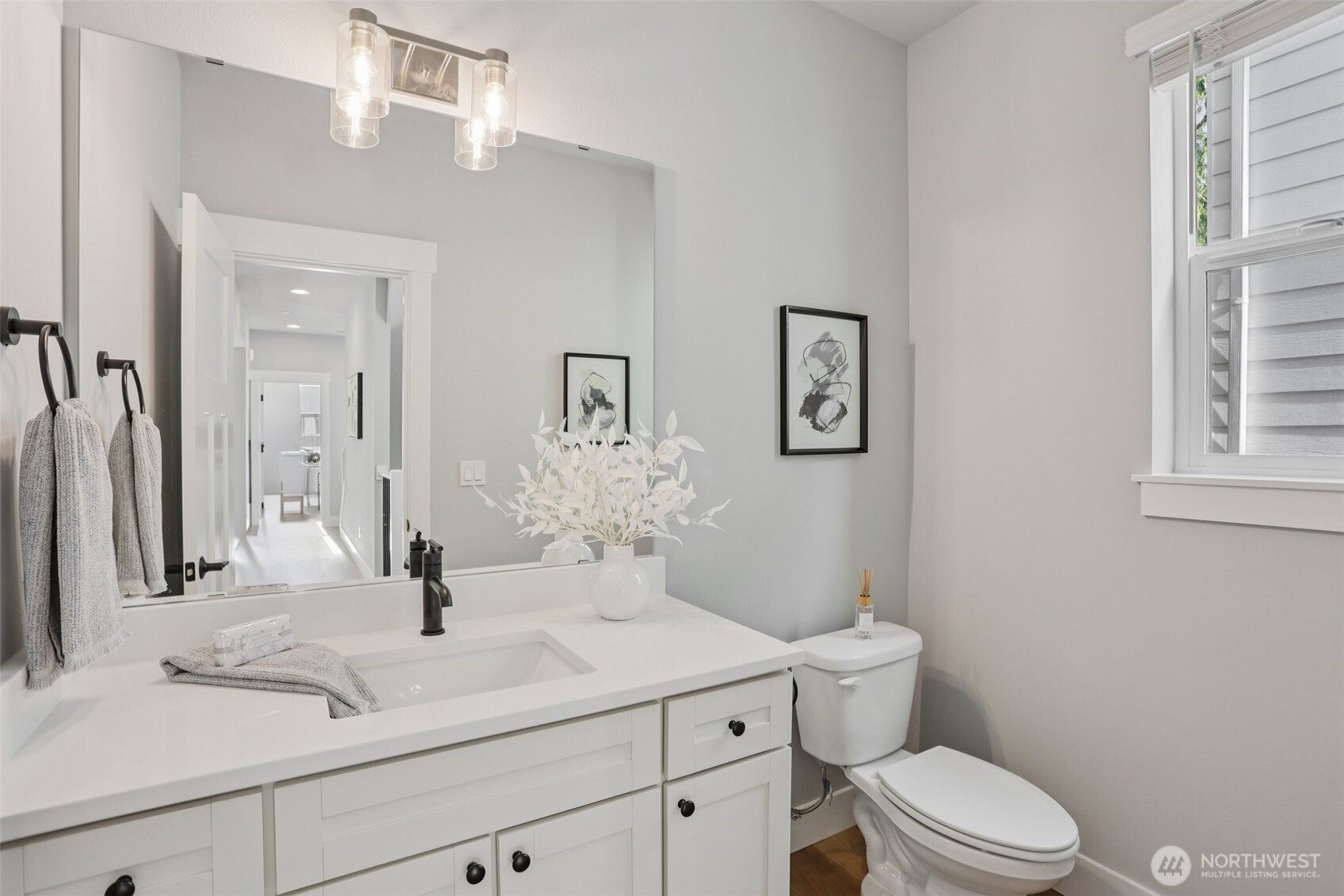 15 160th Place Southeast Bothell, WA 98012 - Photo 20 of 36 a bathroom with a sink a toilet and a mirror