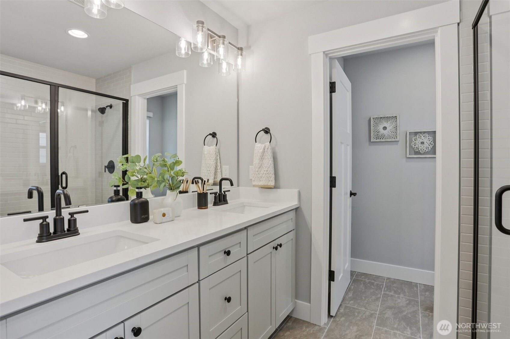 15 160th Place Southeast Bothell, WA 98012 - Photo 25 of 36 a bathroom with double vanity sink a mirror and a shower