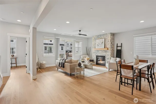 a living room with fireplace furniture and a wooden floor
