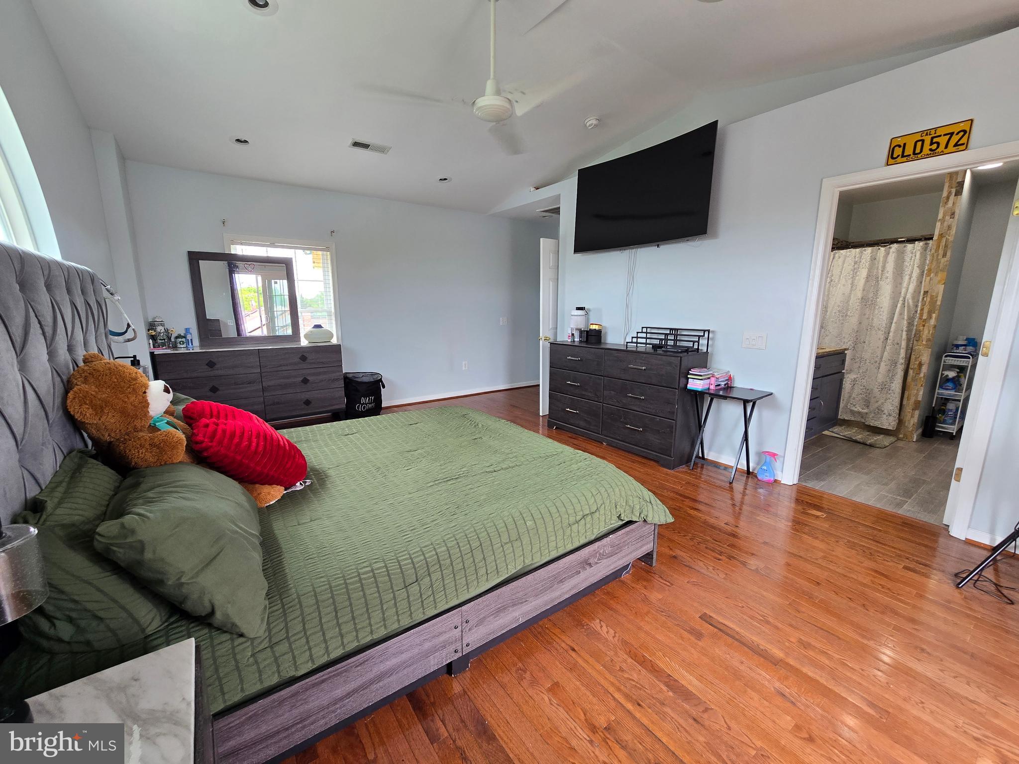 7513 Saffron Court Hanover, MD 21076 - Photo 24 of 42 a bedroom with a bed and flat screen tv