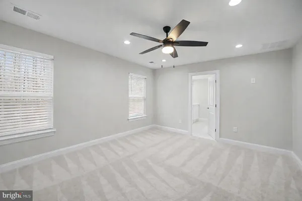 a view of an empty room with a flat screen tv