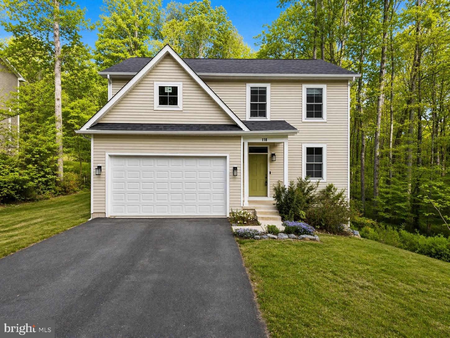 118 Ackerman Lane Ruther Glen, VA 22546 - Photo 2 of 57 Charming home nestled in lush greenery.