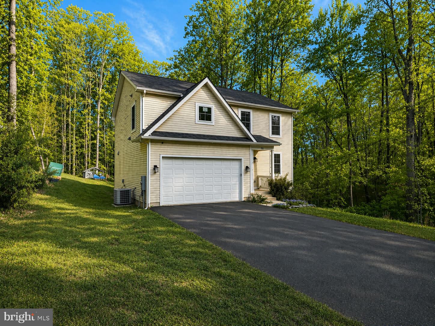 118 Ackerman Lane Ruther Glen, VA 22546 - Photo 3 of 57 a front view of a house with a yard and garage