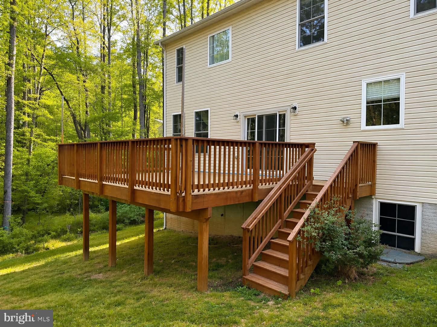 118 Ackerman Lane Ruther Glen, VA 22546 - Photo 35 of 57 Charming elevated deck in nature's embrace.