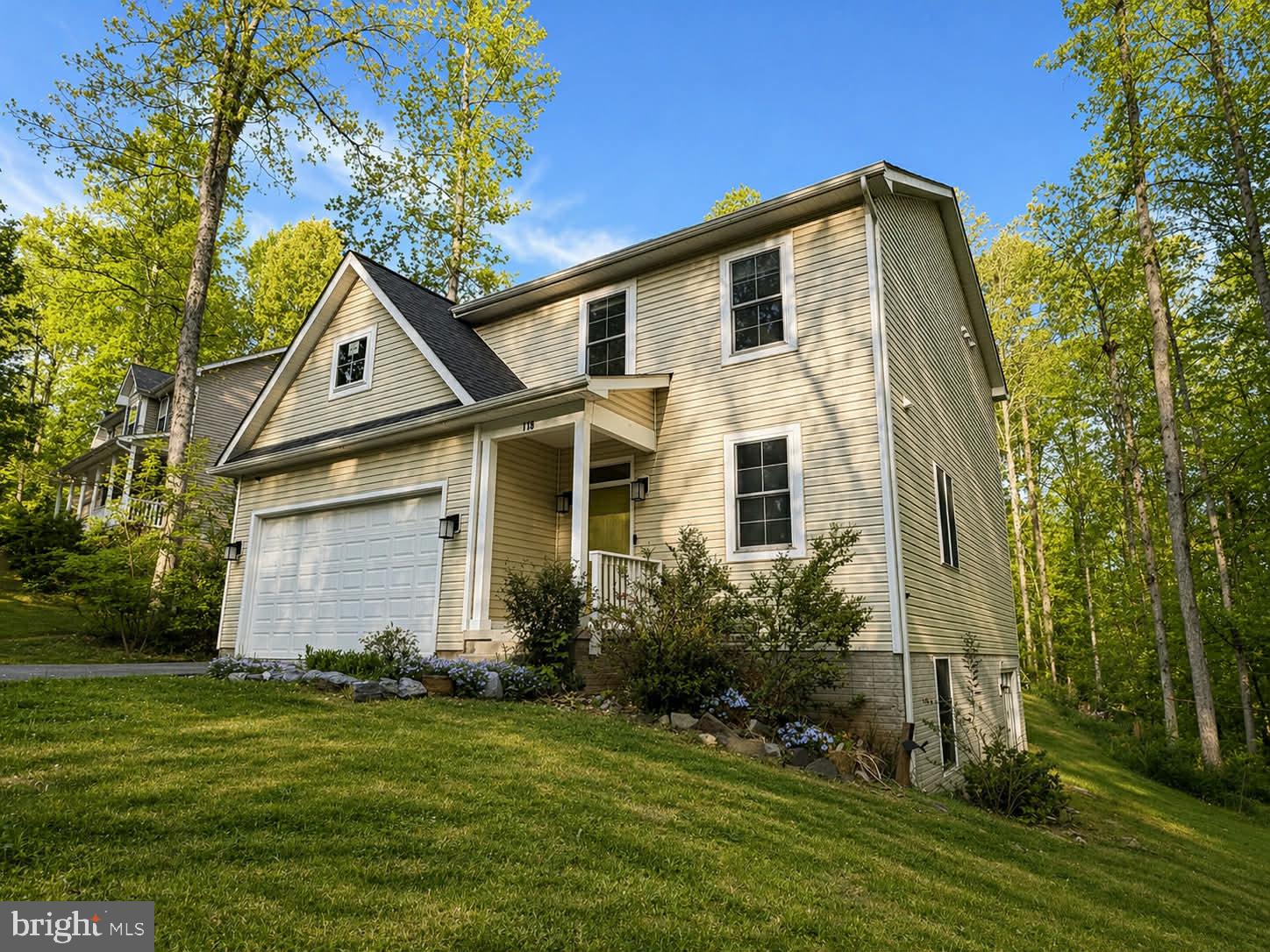 118 Ackerman Lane Ruther Glen, VA 22546 - Photo 4 of 57 a front view of a house with a yard and trees
