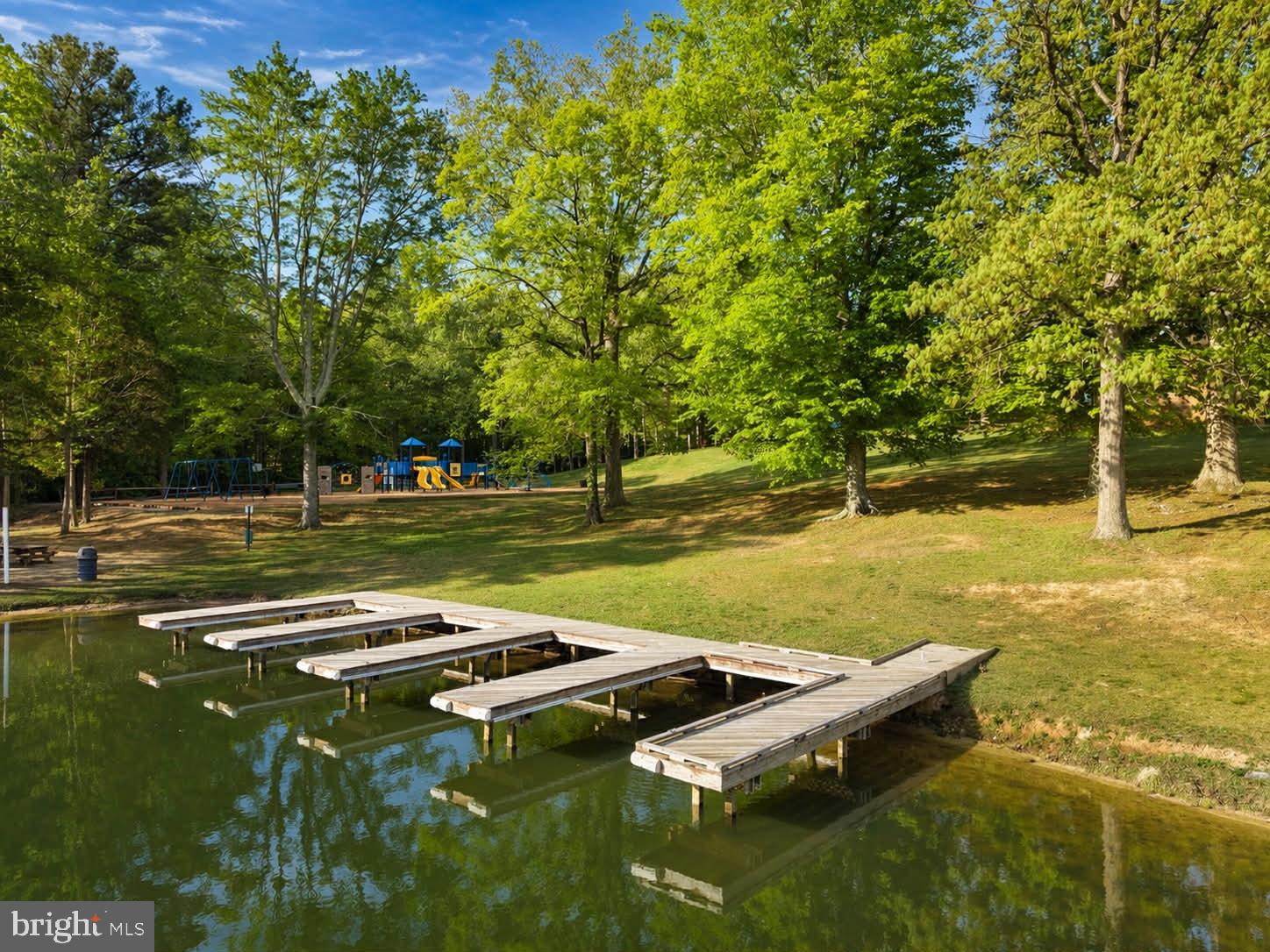 118 Ackerman Lane Ruther Glen, VA 22546 - Photo 41 of 57 a view of a golf course with a lake