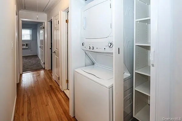 a view of washer and dryer with wooden floor