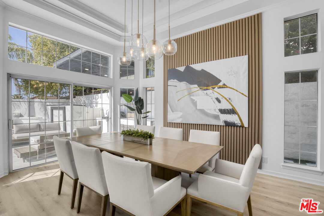 19668 Pine Valley Way Porter Ranch, CA 91326 - Photo 11 of 52 a view of a dining room with furniture wooden floor and chandelier