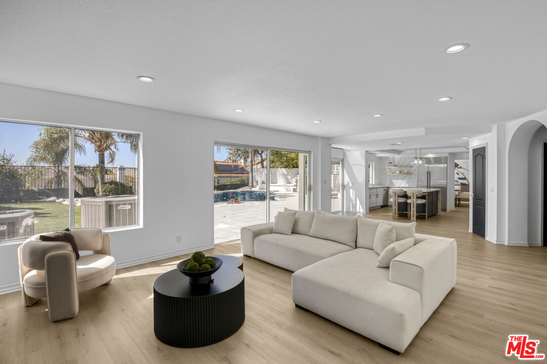 19668 Pine Valley Way Porter Ranch, CA 91326 - Photo 18 of 52 a living room with furniture and a large window