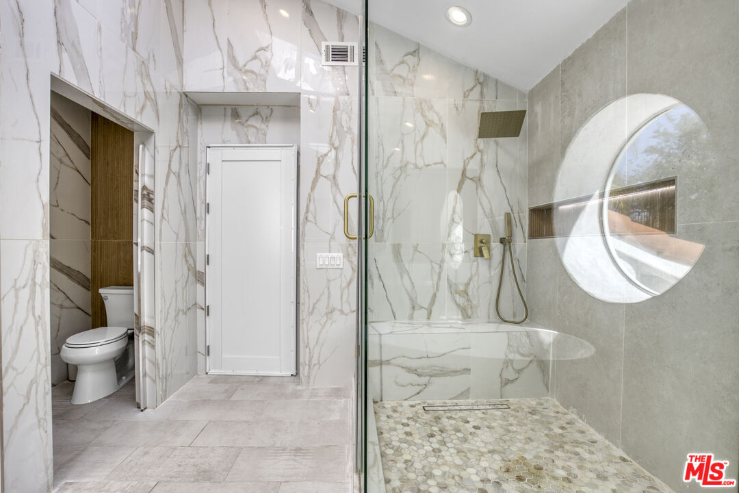 19668 Pine Valley Way Porter Ranch, CA 91326 - Photo 30 of 52 a bathroom with a sink and toilet