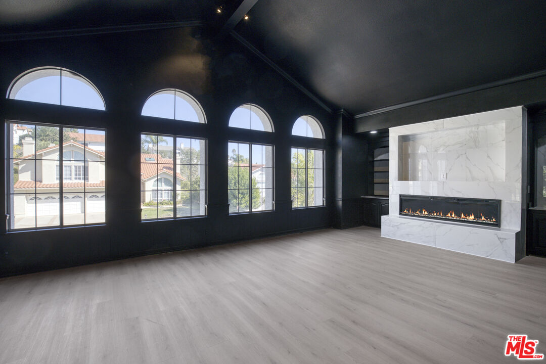 19668 Pine Valley Way Porter Ranch, CA 91326 - Photo 35 of 52 wooden floor in an empty room with a window