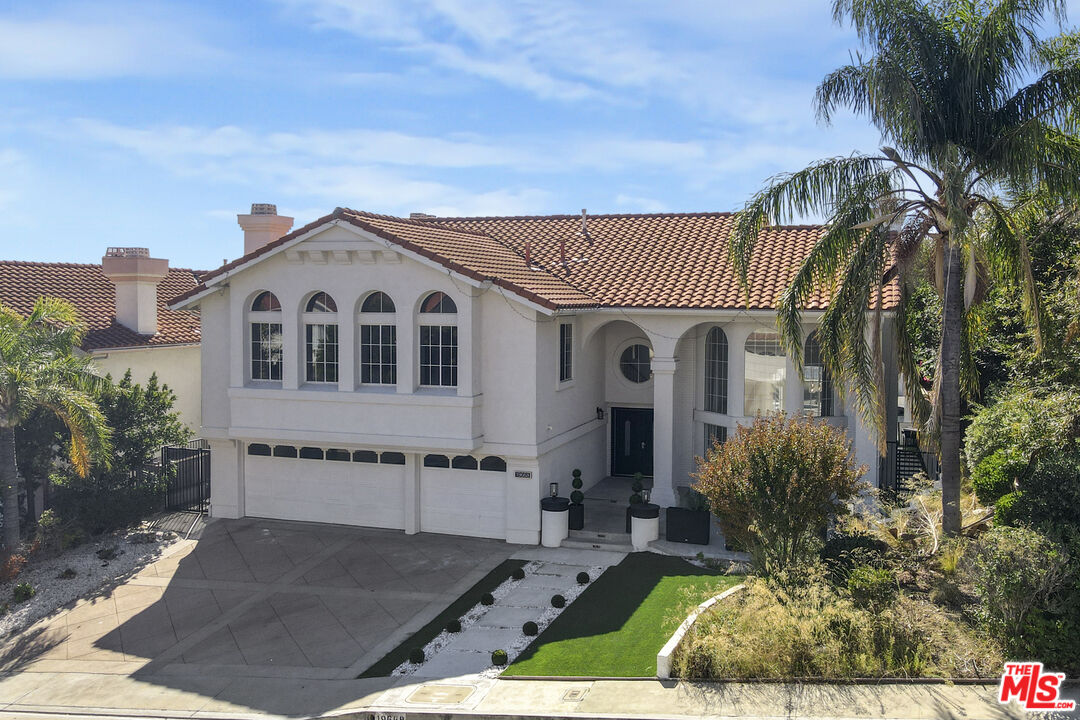 19668 Pine Valley Way Porter Ranch, CA 91326 - Photo 43 of 52 a view of a house with a yard