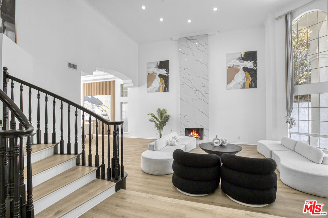 19668 Pine Valley Way Porter Ranch, CA 91326 - Photo 5 of 52 a living room with furniture and a window