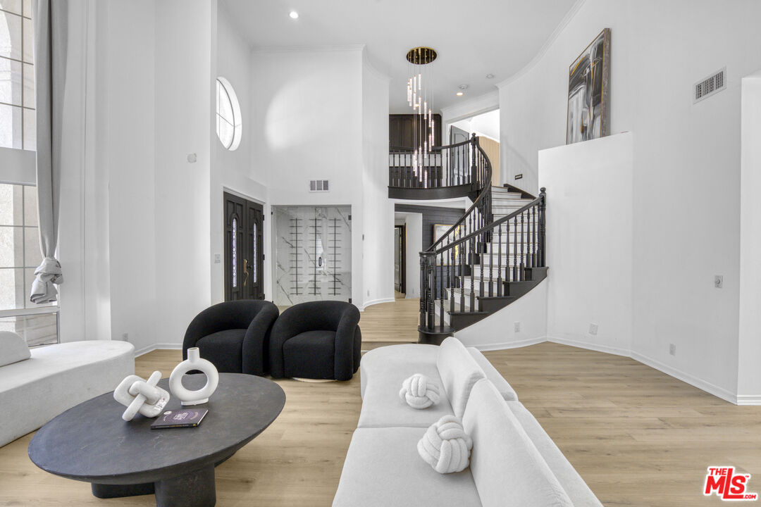 19668 Pine Valley Way Porter Ranch, CA 91326 - Photo 8 of 52 a living room with furniture and wooden floor