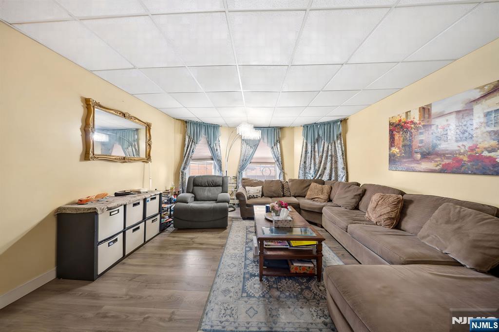 409 Hamilton Street Harrison, NJ 07029 - Photo 22 of 44 a living room with furniture and a window