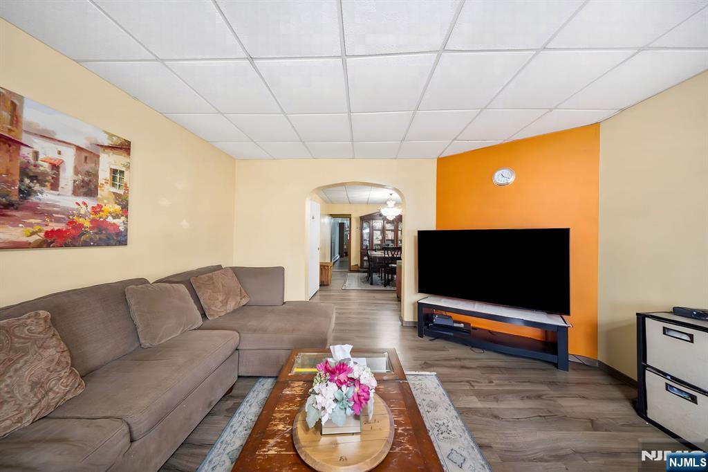 409 Hamilton Street Harrison, NJ 07029 - Photo 25 of 44 a living room with furniture and a flat screen tv