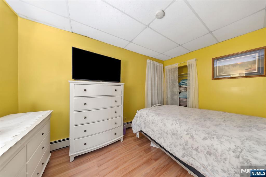 409 Hamilton Street Harrison, NJ 07029 - Photo 26 of 44 a bedroom with a bed and furniture