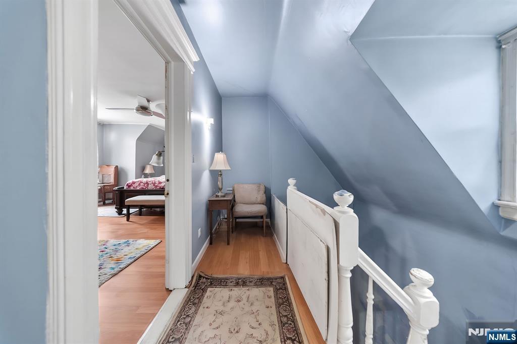 409 Hamilton Street Harrison, NJ 07029 - Photo 34 of 44 a living room with furniture and a fireplace
