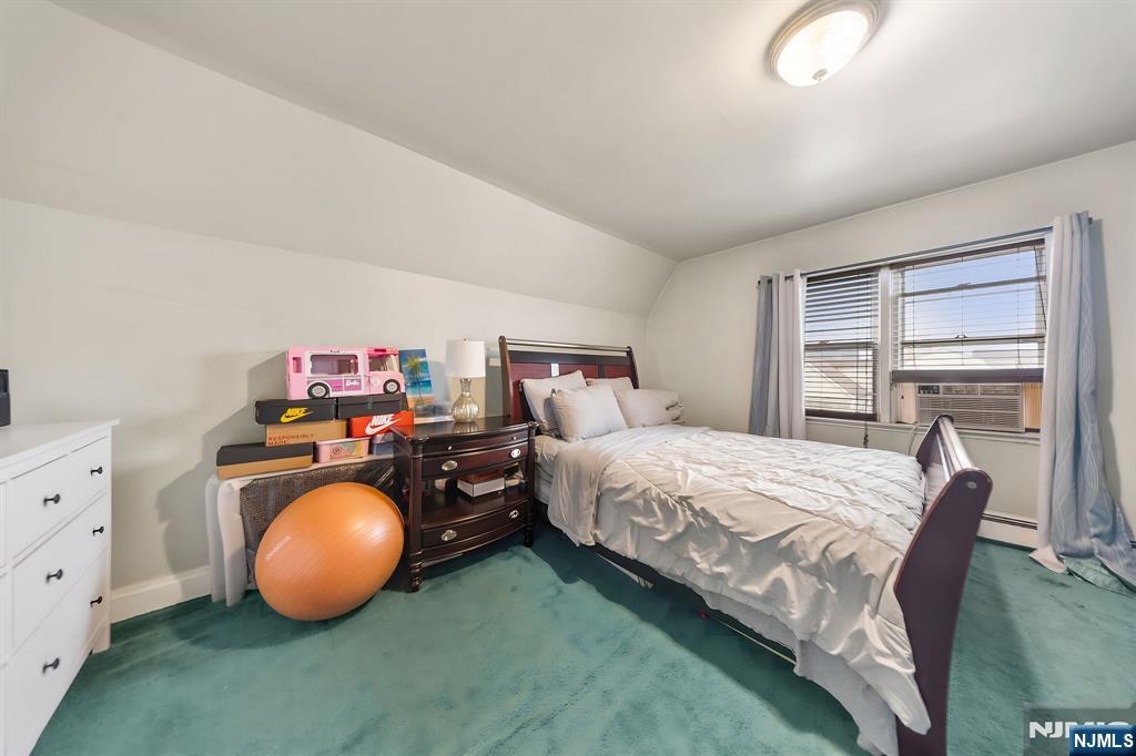 409 Hamilton Street Harrison, NJ 07029 - Photo 38 of 44 a bedroom with bed and a window