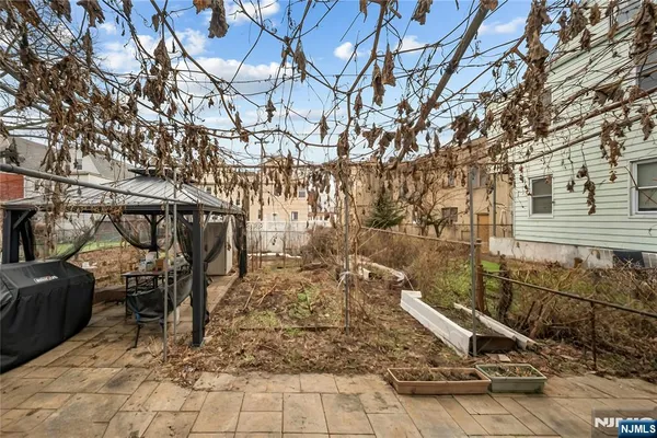 a view of a backyard of the house