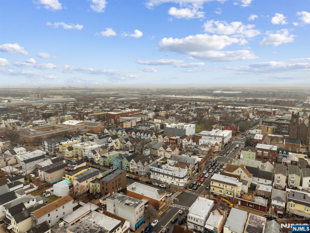 409 Hamilton Street Harrison, NJ 07029 - Photo 5 of 44 an aerial view of residential building with green space