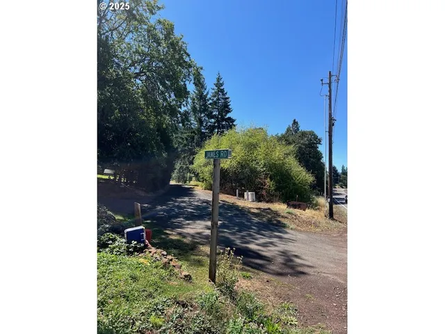 a backyard of a house with yard and outdoor seating