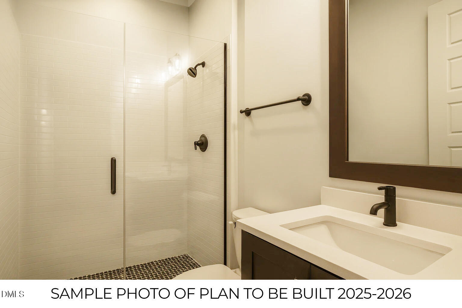 819 Homestead Road Chapel Hill, NC 27516 - Photo 15 of 28 a bathroom with a sink a mirror and shower