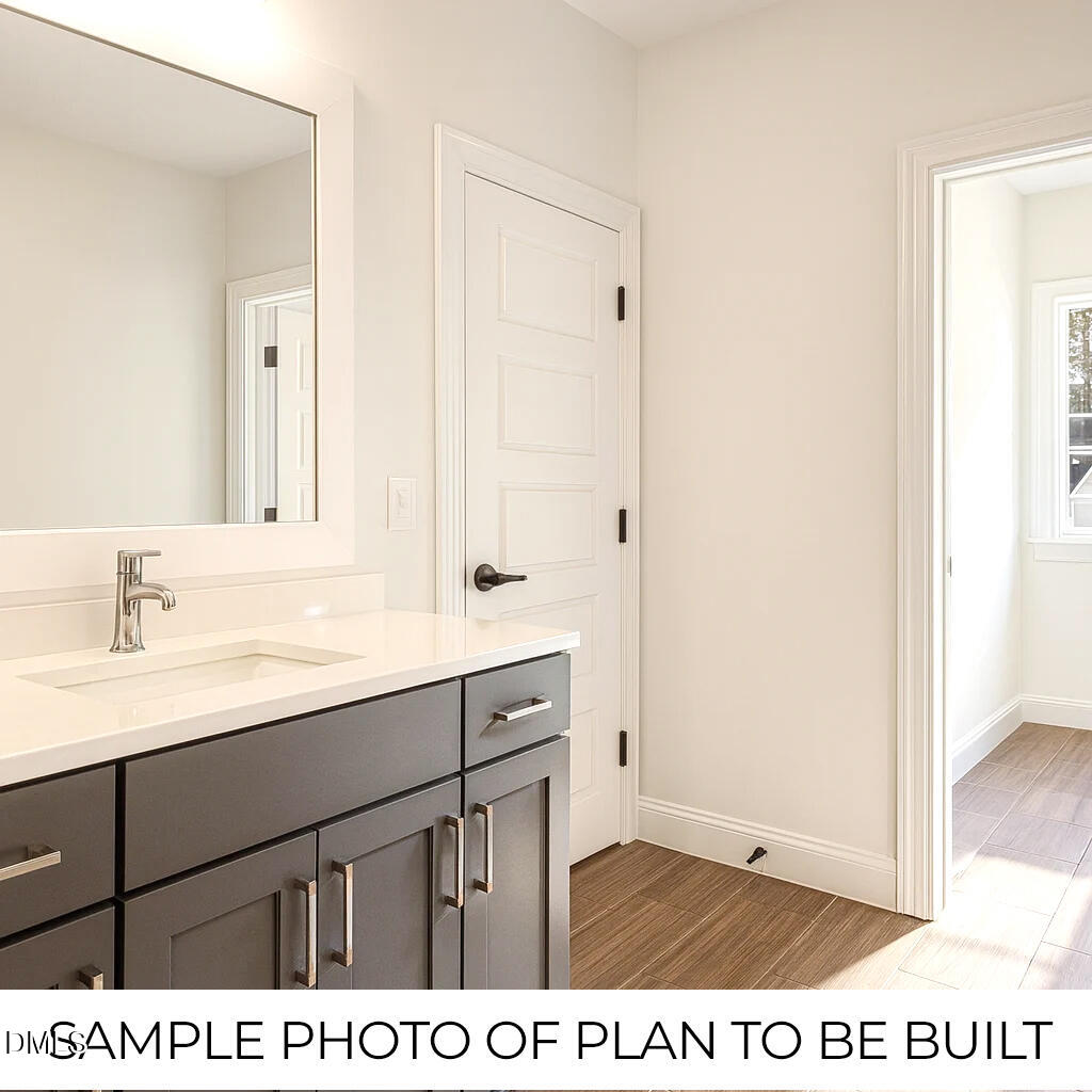 819 Homestead Road Chapel Hill, NC 27516 - Photo 20 of 28 a bathroom with a sink a vanity and a mirror