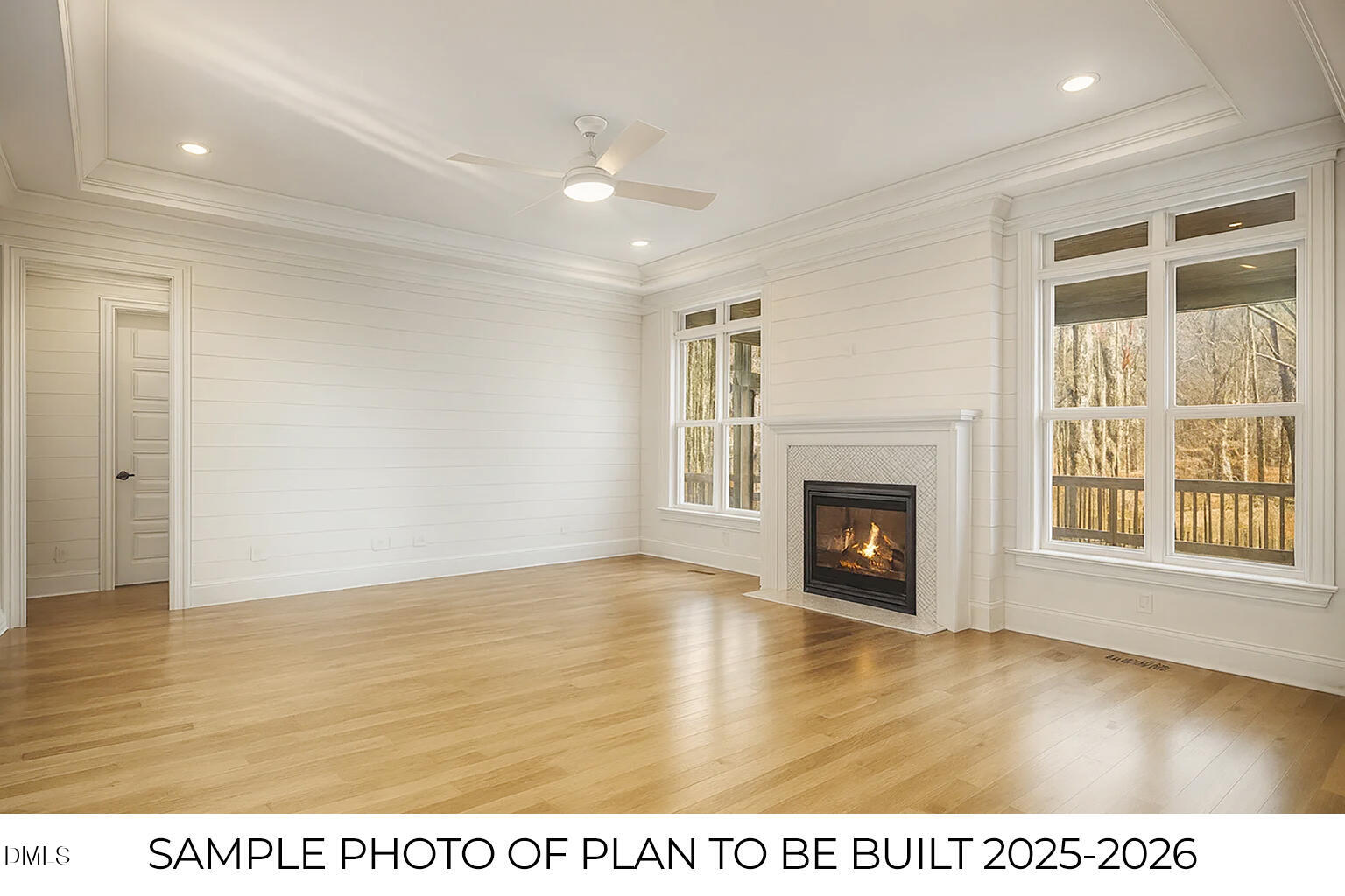 819 Homestead Road Chapel Hill, NC 27516 - Photo 4 of 28 a view of an empty room with wooden floor fireplace and a window