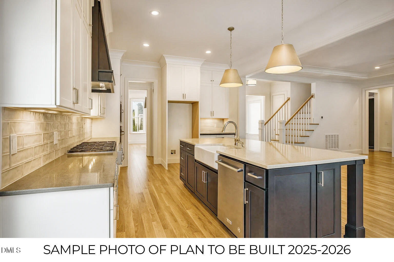 819 Homestead Road Chapel Hill, NC 27516 - Photo 7 of 28 a kitchen with kitchen island granite countertop a sink a counter top space appliances and cabinets
