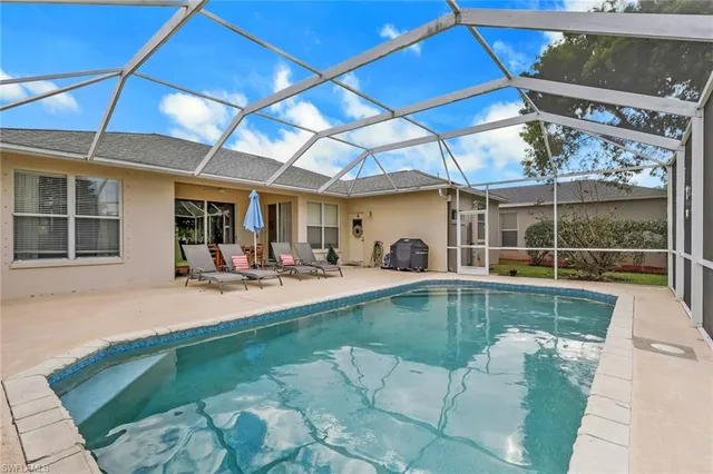 a view of a swimming pool with a patio