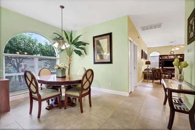 a dining room with furniture and window