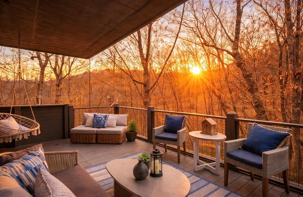 220 Wake Robin Drive Jasper, GA 30143 - Photo 2 of 81 a outdoor living space with patio furniture and a potted plant