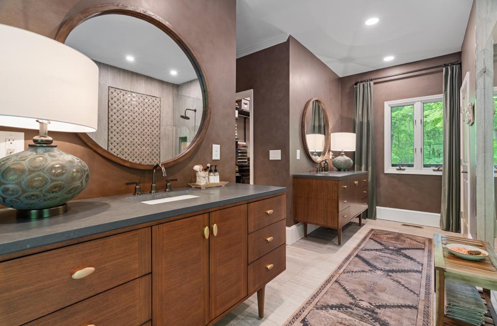 220 Wake Robin Drive Jasper, GA 30143 - Photo 28 of 81 a spacious bathroom with a double vanity sink and a mirror