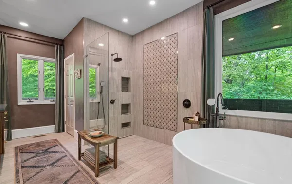 a bathroom with a sink a large mirror and a vanity