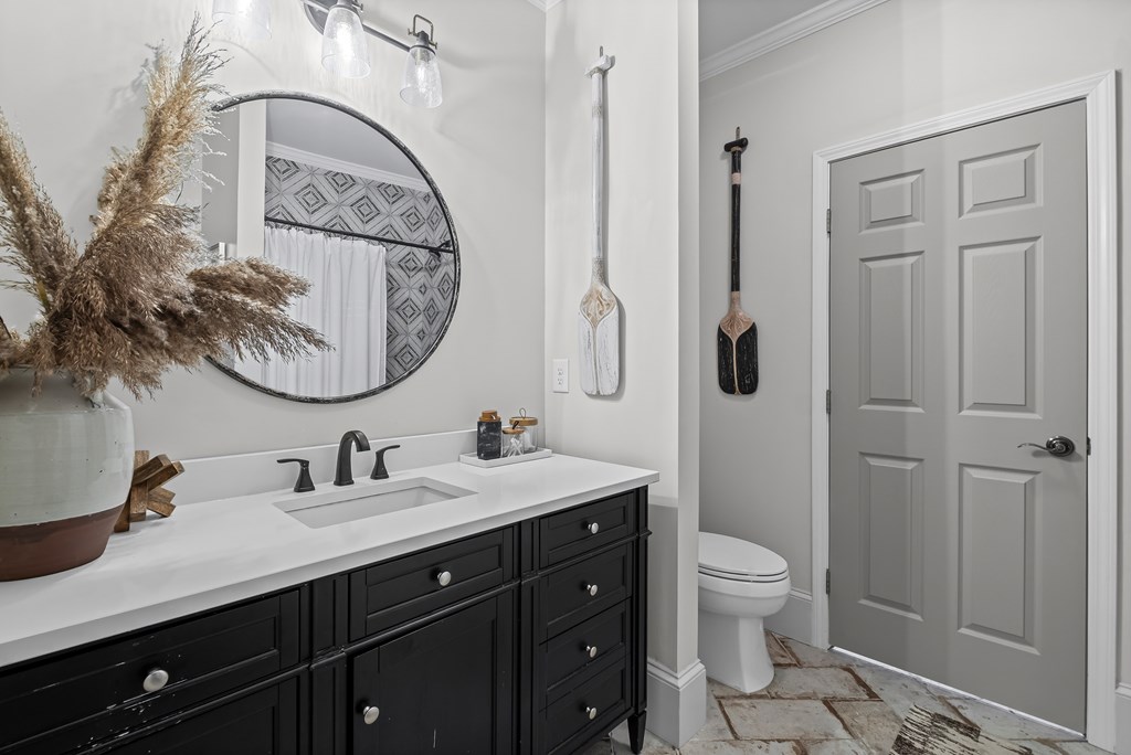 220 Wake Robin Drive Jasper, GA 30143 - Photo 38 of 81 a bathroom with a toilet a sink a mirror a vanity and shower