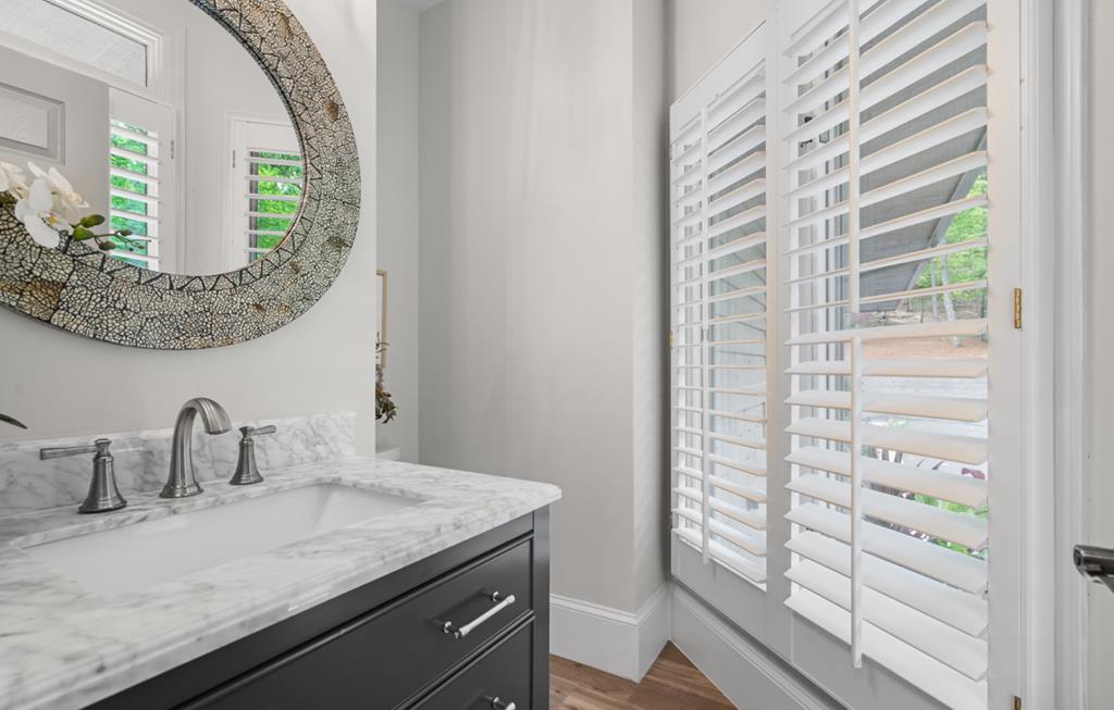 220 Wake Robin Drive Jasper, GA 30143 - Photo 41 of 81 a bathroom with a granite countertop sink and a mirror